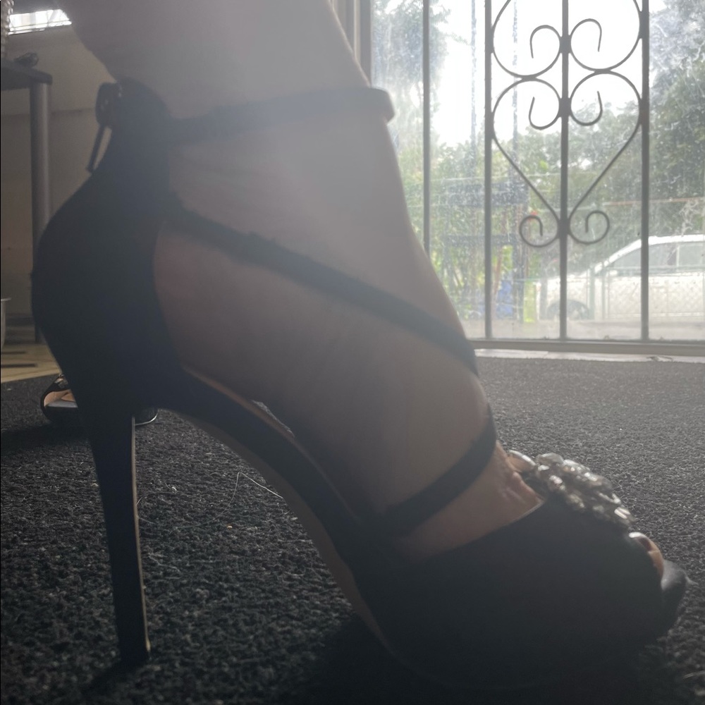 Black stiletto heels zip up back.